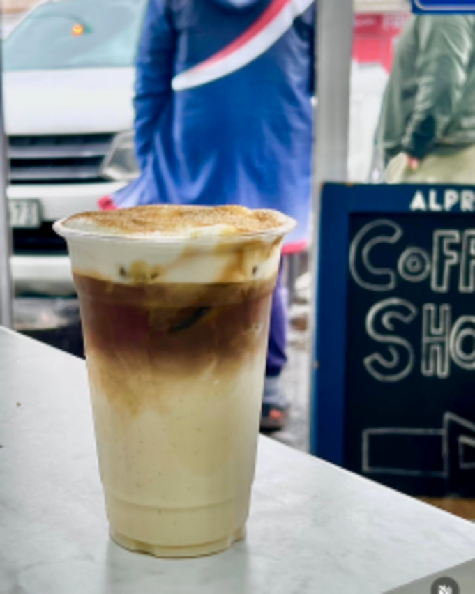 A brown sugar latte on the counter of the pop-up stand